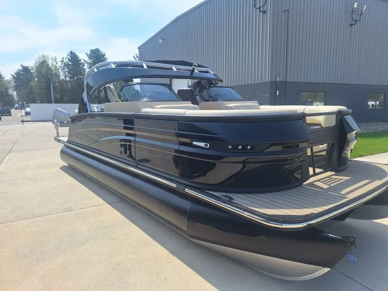 Finished dark pontoon boat viewed from the aft quarter